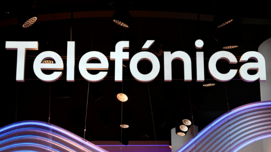 Spain's Telefonica shares drop on dividend cut, net loss