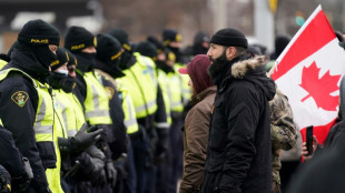 Canada police work to clear key border bridge as Ottawa protest again grows