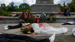 Activists hold 'die-in' protest at Soviet monument in Warsaw