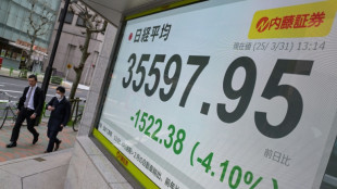 Japan's Nikkei leads hefty market losses, gold hits record