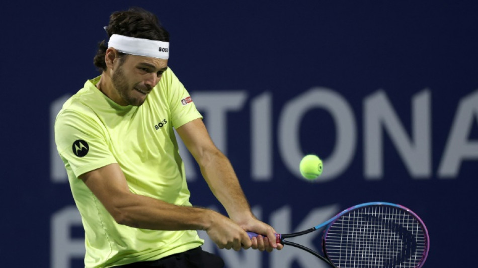 Fritz beats rain, Carballes Baena, to advance in Toronto