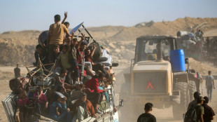 Palestinians return to devastated Gaza City as truce holds