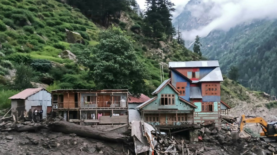 Indian rescuers scour debris after 60 killed in flood