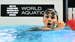 McIntosh romps to world 400m freestyle gold, Ledecky third