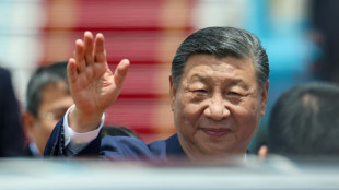 Xi warns protectionism 'leads nowhere' as he arrives in Vietnam 