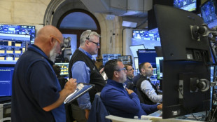 Wall Street cl&ocirc;ture en nette hausse, record du Dow Jones