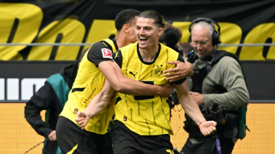 Dortmund complete escape act to snatch Champions League berth