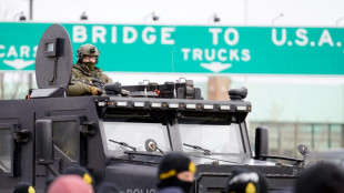 Police positioned to clear key border bridge of protesters in Canada: AFP journalist