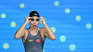 'Emotional' Yu, 12, celebrates historic world swimming medal