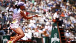 Swiatek and Sabalenka set up French Open semi-final clash as Musetti reaches last four