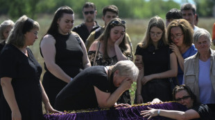 'Back home': family who fled front buried after Kyiv strike