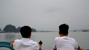 Anxious relatives await news from Vietnam wreck rescue