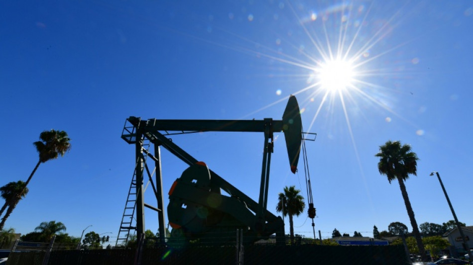 Oil drops, stocks climb as Trump delays Iran move