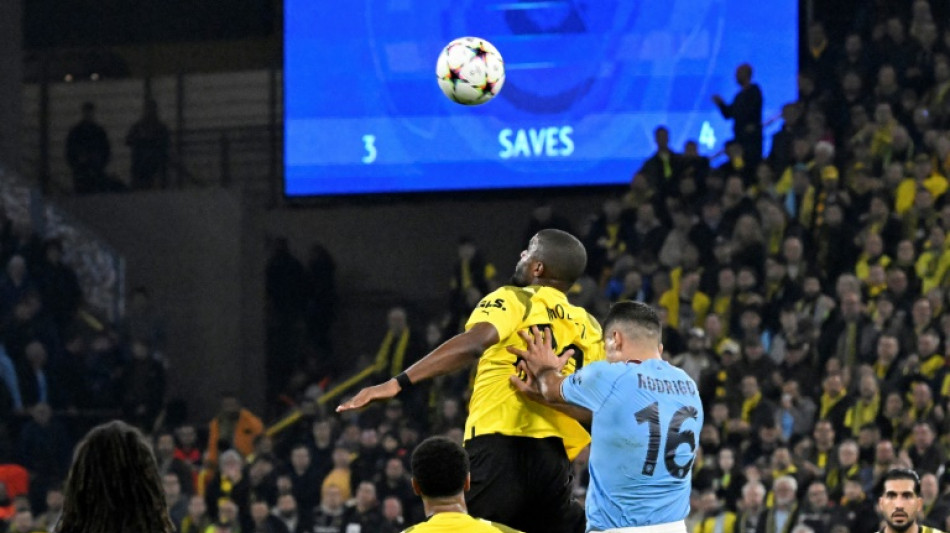 Dortmund reach last 16 after Mahrez's penalty miss
