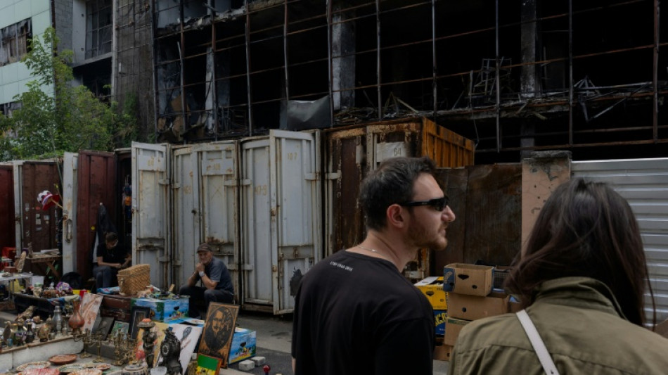 Kyiv's desperate vendors persevere outside obliterated flea market