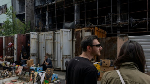 Kyiv's desperate vendors persevere outside obliterated flea market